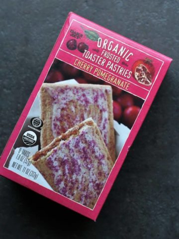 Trader Joe's Organic Frosted Cherry Pomegranate Toaster Pastries on a dark surface