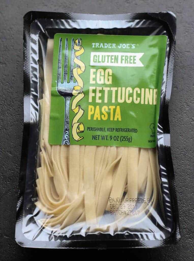 Trader Joe's Gluten Free Egg Fettuccine Pasta on a dark tile