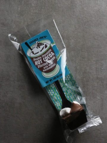 An unopened package of Trader Joe's Double Chocolate Hot Cocoa Stirring Spoon