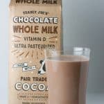 Trader Joe's Chocolate Whole Milk in a glass next to the package