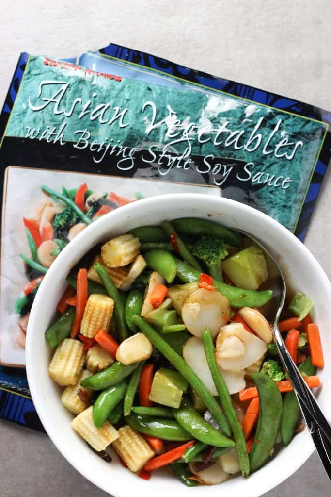 Trader Joe's Asian Vegetables with Beijing Soy Sauce in a white bowl with a grey background