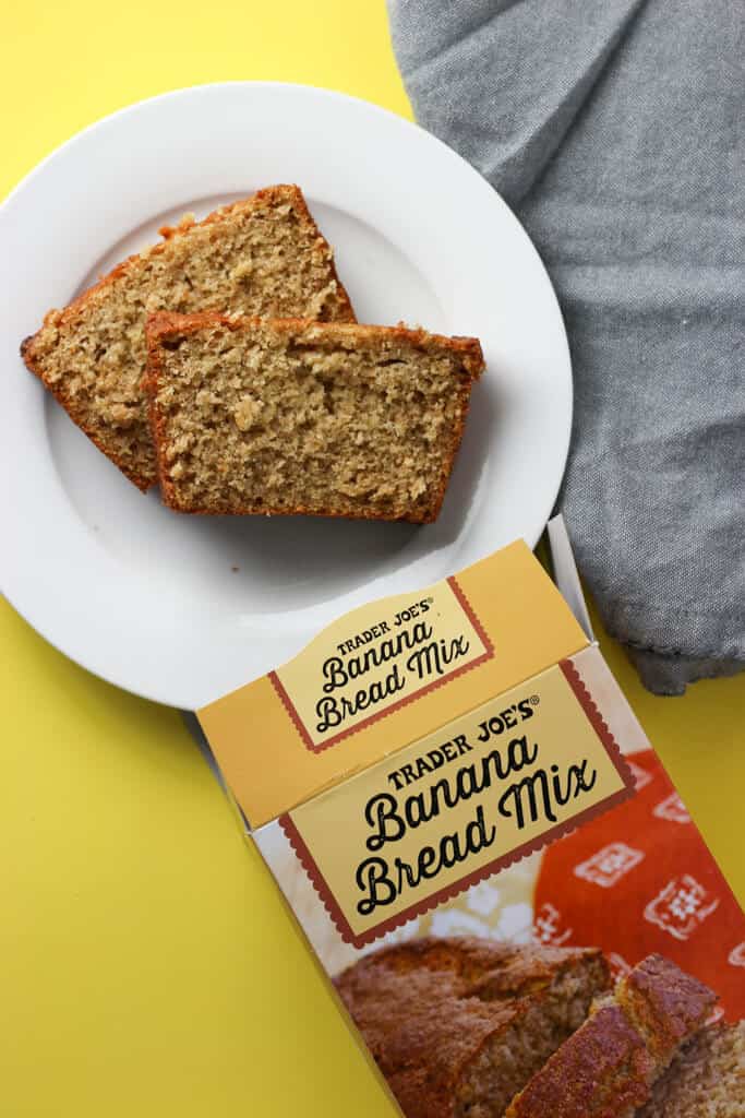 Trader Joe's Banana Bread Mix baked and sliced on a white plate.