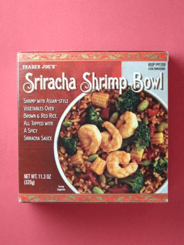 Trader Joe's Sriracha Shrimp Bowl package on a red background