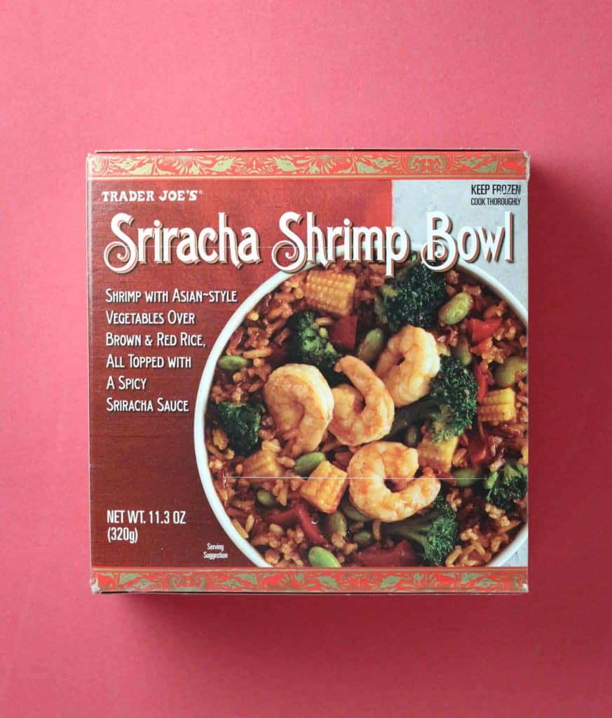 Trader Joe's Sriracha Shrimp Bowl package on a red background