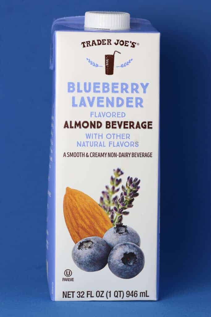 Trader Joe's Blueberry Lavender Flavored Almond Beverage package on a blue background.