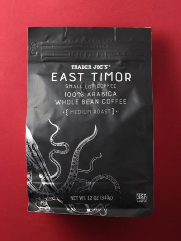 Trader Joe's East Timor Small Lot Coffee bag on a red background