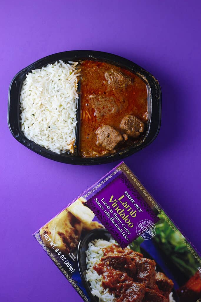 Trader Joe's Lamb Vindaloo fully cooked on a purple background