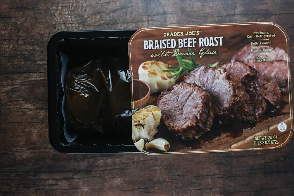 Trader Joe's Braised Beef Roast with Demi Glace with the box open showing the plastic package on the inside