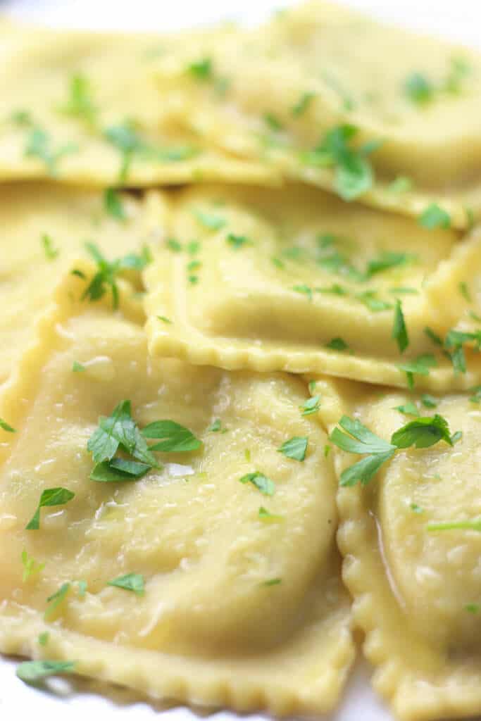 A zoomed in picture of fully cooked Trader Joe's Sweet Italian Sausage and Four Cheese Ravioli