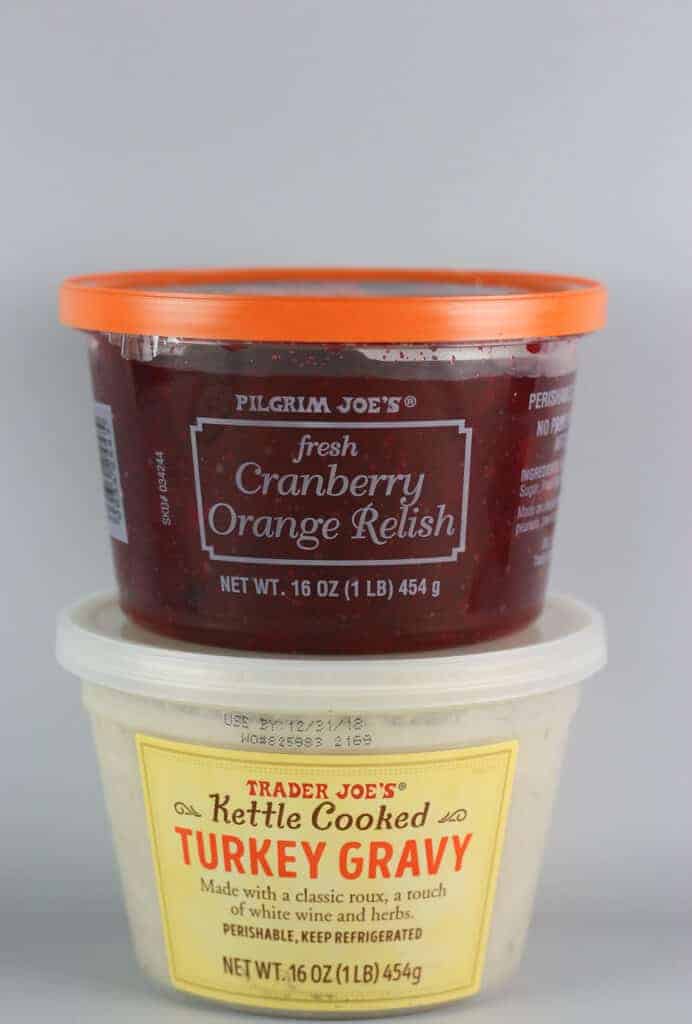 Unopened containers of Trader Joe's Fresh Cranberry Orange Relish and Kettle Cooked Turkey Gravy