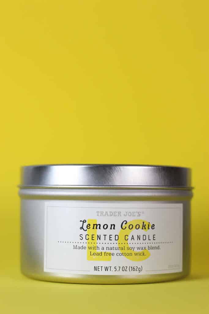 Trader Joe's Lemon Cookie Scented Candle on a yellow background
