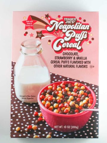 An unopened box of Trader Joe's Neapolitan Puffs Cereal