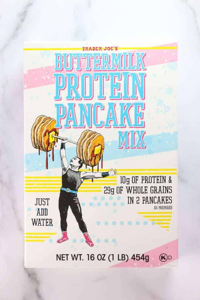 An unopened box of Trader Joe's Buttermilk Protein Pancake Mix on a marble surface