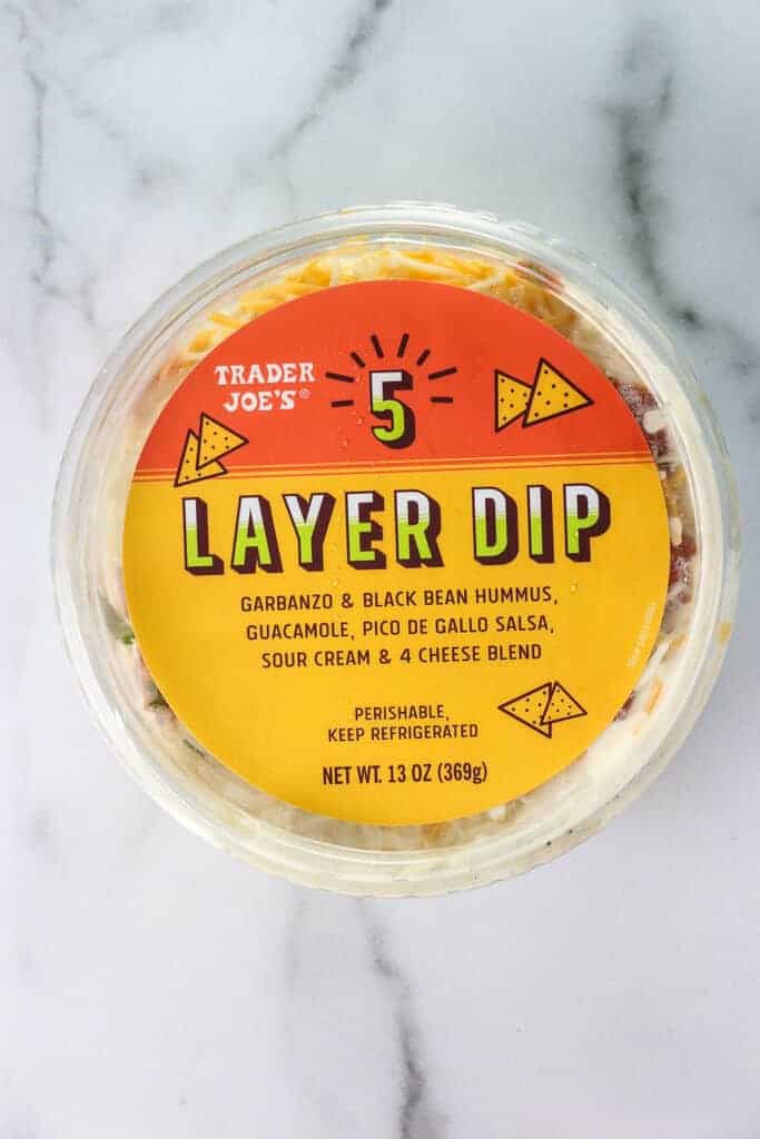 An unopened package of Trader Joe's 5 Layer Dip