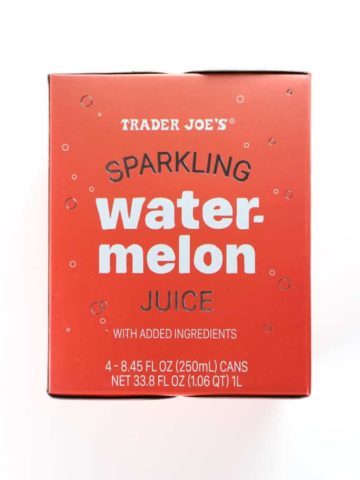 An unopened box of Trader Joe's Sparkling Watermelon Juice on a white surface