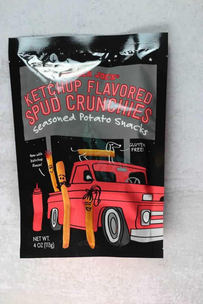 An unopened bag of Trader Joe's Ketchup Flavored Spud Crunchies