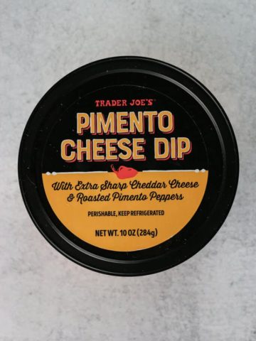 An unopened container of Trader Joe's Pimento Cheese Dip