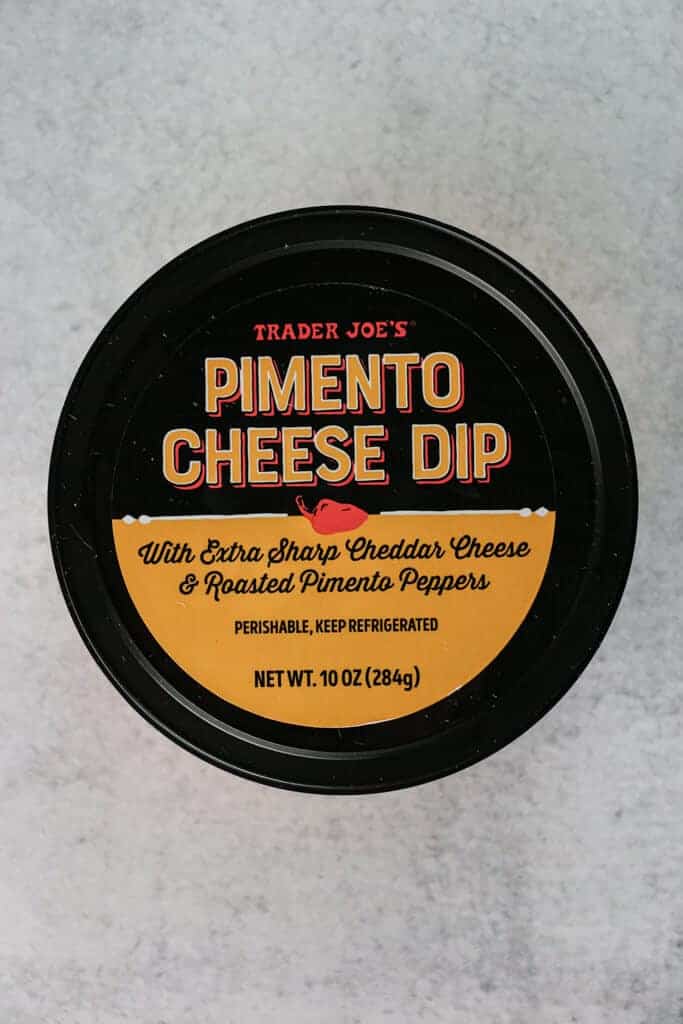 An unopened container of Trader Joe's Pimento Cheese Dip