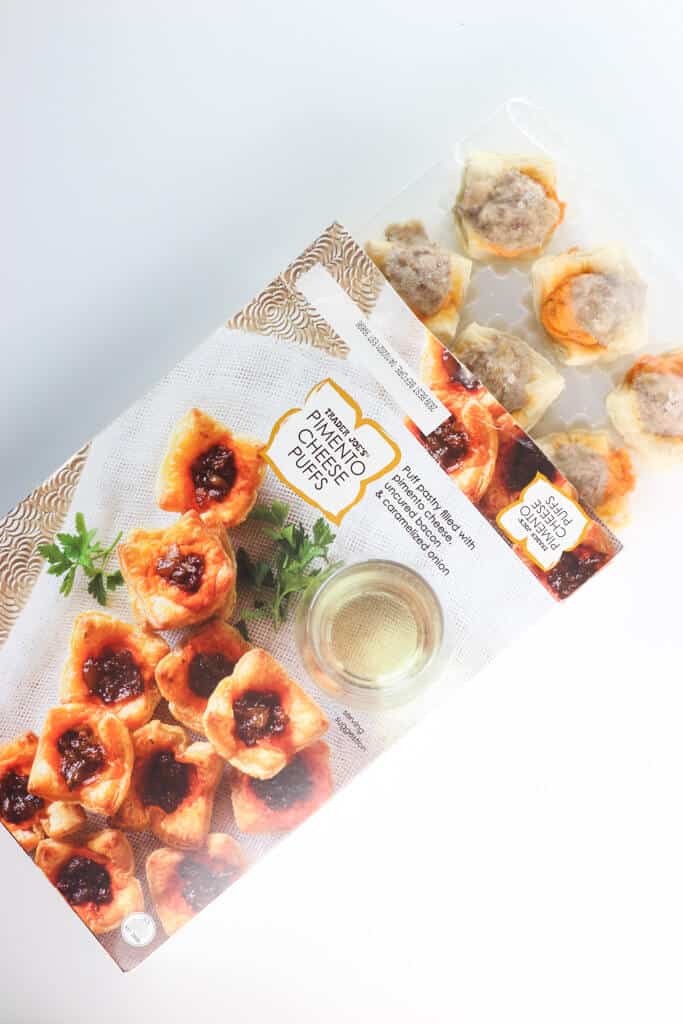 An open box of Trader Joe's Pimento Cheese Puffs revealing the contents