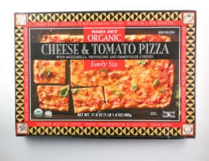 An unopened box of Trader Joe's Organic Cheese and Tomato Family Size Pizza