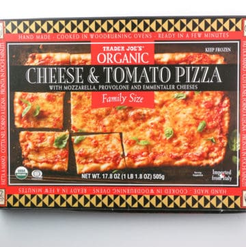 An unopened box of Trader Joe's Organic Cheese and Tomato Family Size Pizza