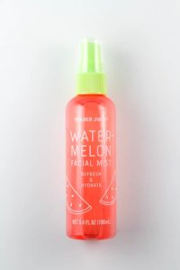 An unopened bottle of Trader Joe's Watermelon Facial Mist on a white surface