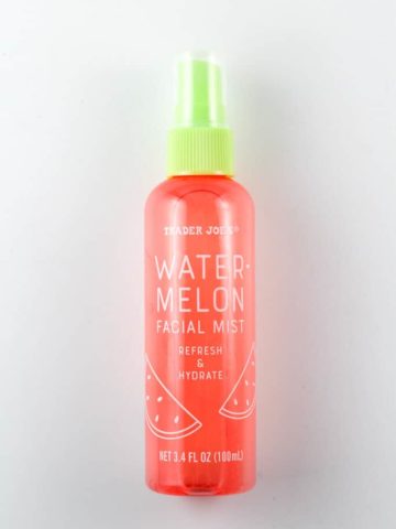 An unopened bottle of Trader Joe's Watermelon Facial Mist on a white surface