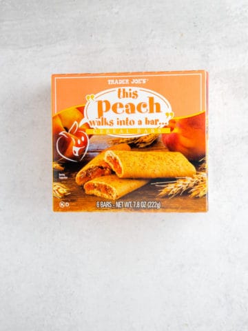 A box of peach flavored cookies on a white surface