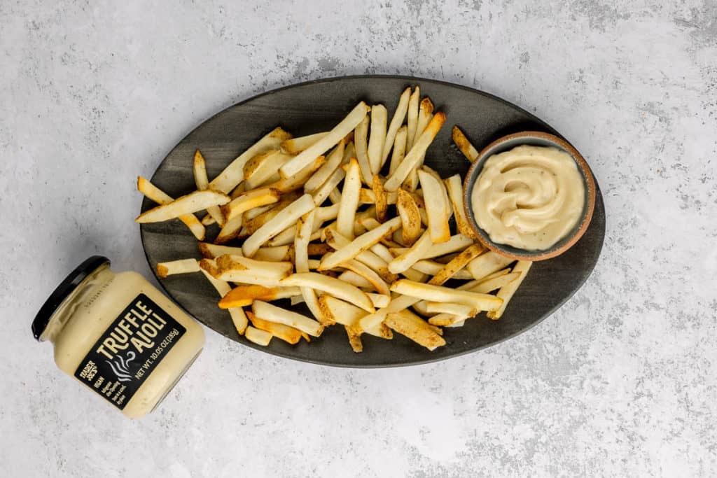 Trader Joe's Truffle Aioli with a plate of french fries.