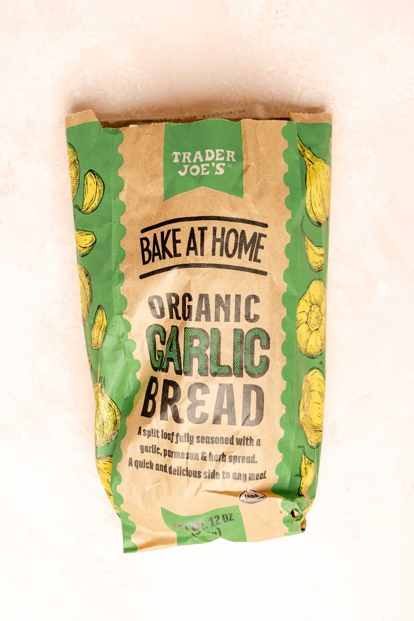 An unopened bag of Trader Joe's Bake at Home Organic Garlic Bread.