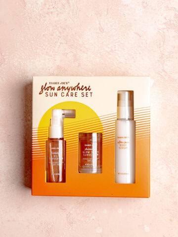 Trader Joe's Glow Anywhere Sun Care Set on a pink surface.