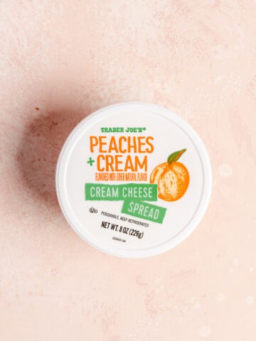 An unopened package of Trader Joe's Peaches and Cream Cream Cheese Spread.