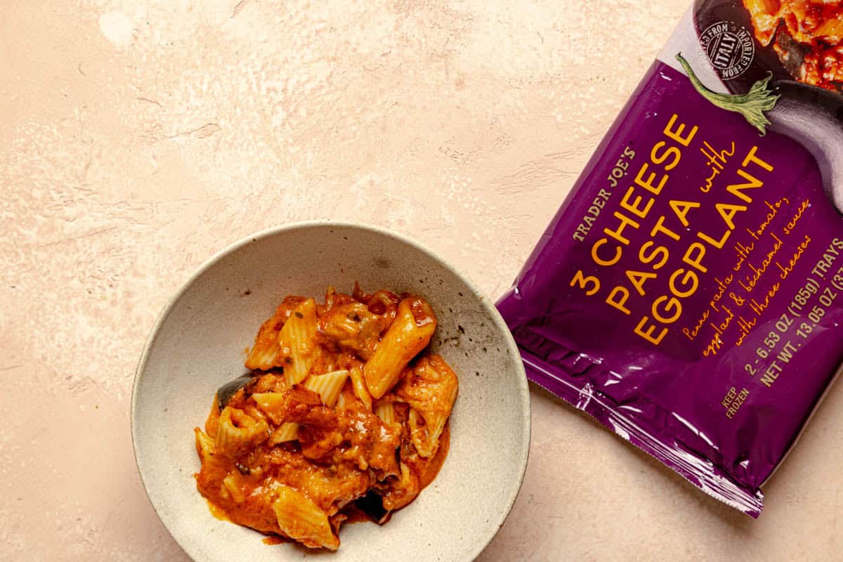 A fully cooked package of Trader Joe's 3 Cheese Pasta with Eggplant in a bowl.