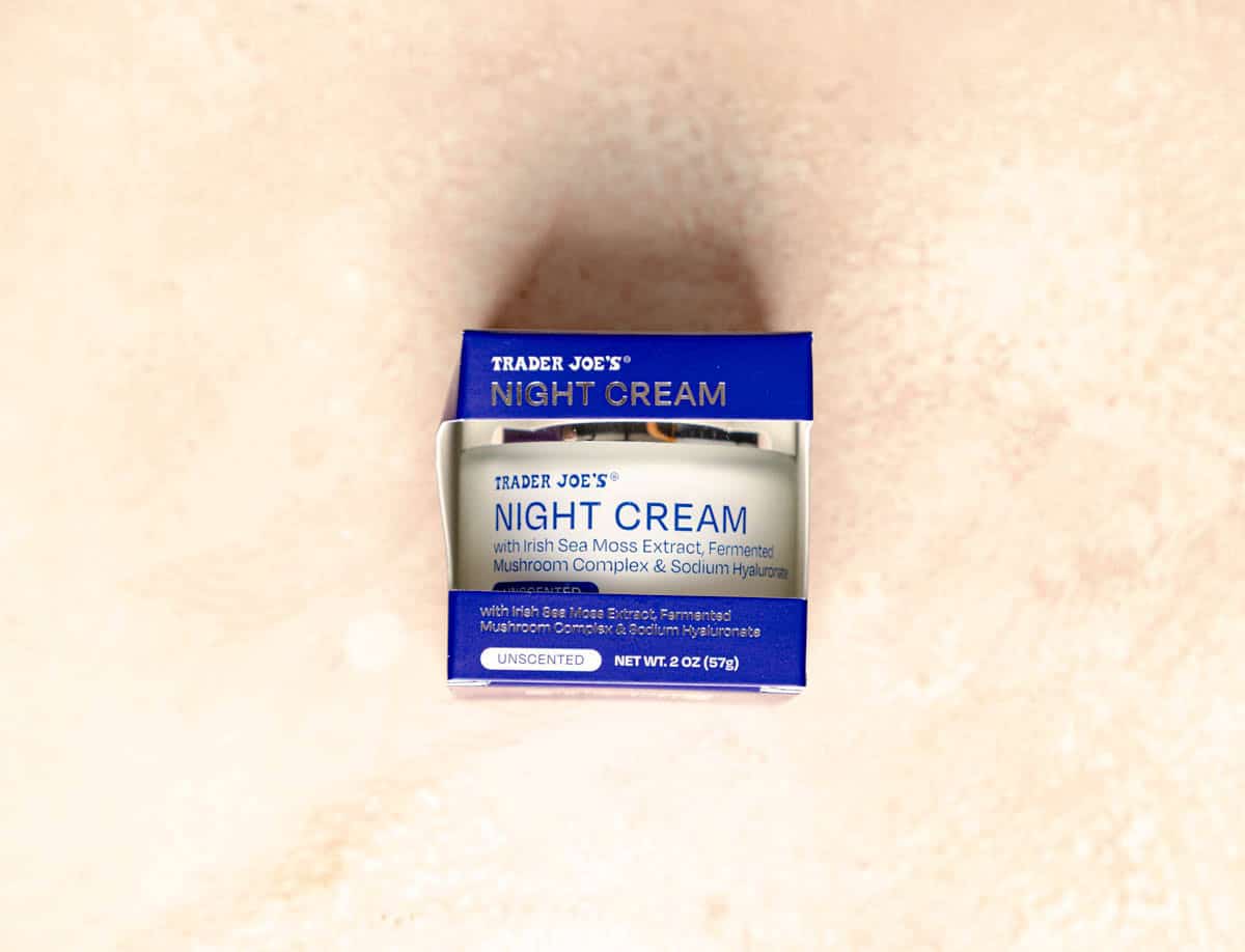 Trader Joe's Night Cream on a pink surface, unopened.