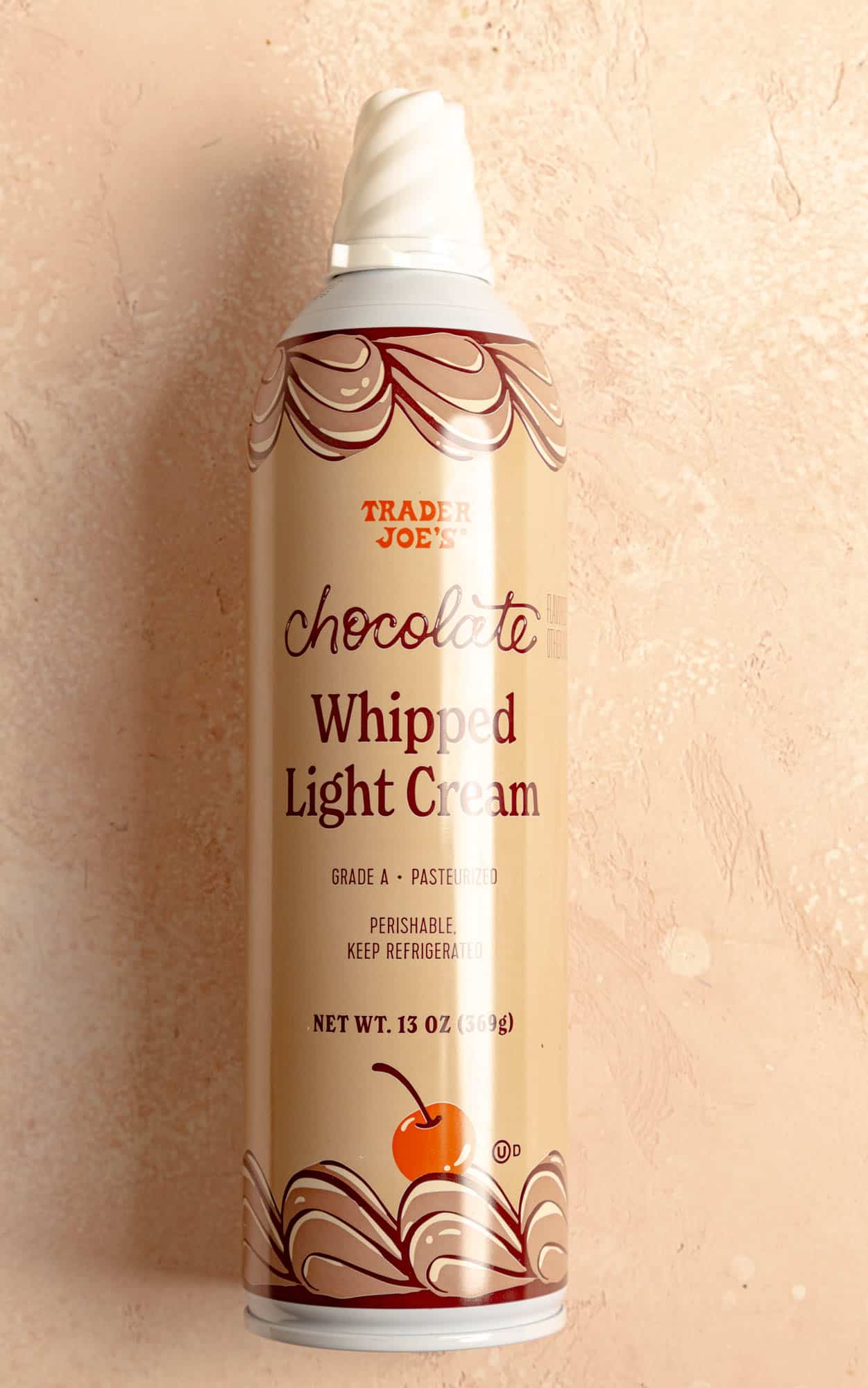 An unopened container of Trader Joe's Chocolate Whipped Light Cream.