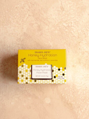Trader Joe's Honey Hydration Face Mask on a pink surface.