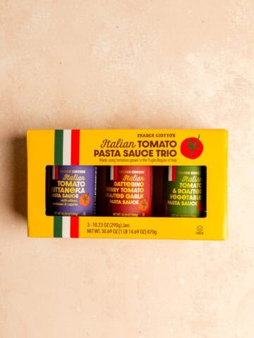 Colorful set of Trader Joe's Italian tomato pasta sauces in jars with vibrant labels on a yellow box.