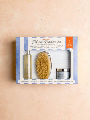 An unopened box of Trader Joe's Marine Radiance Set on a pink surface.