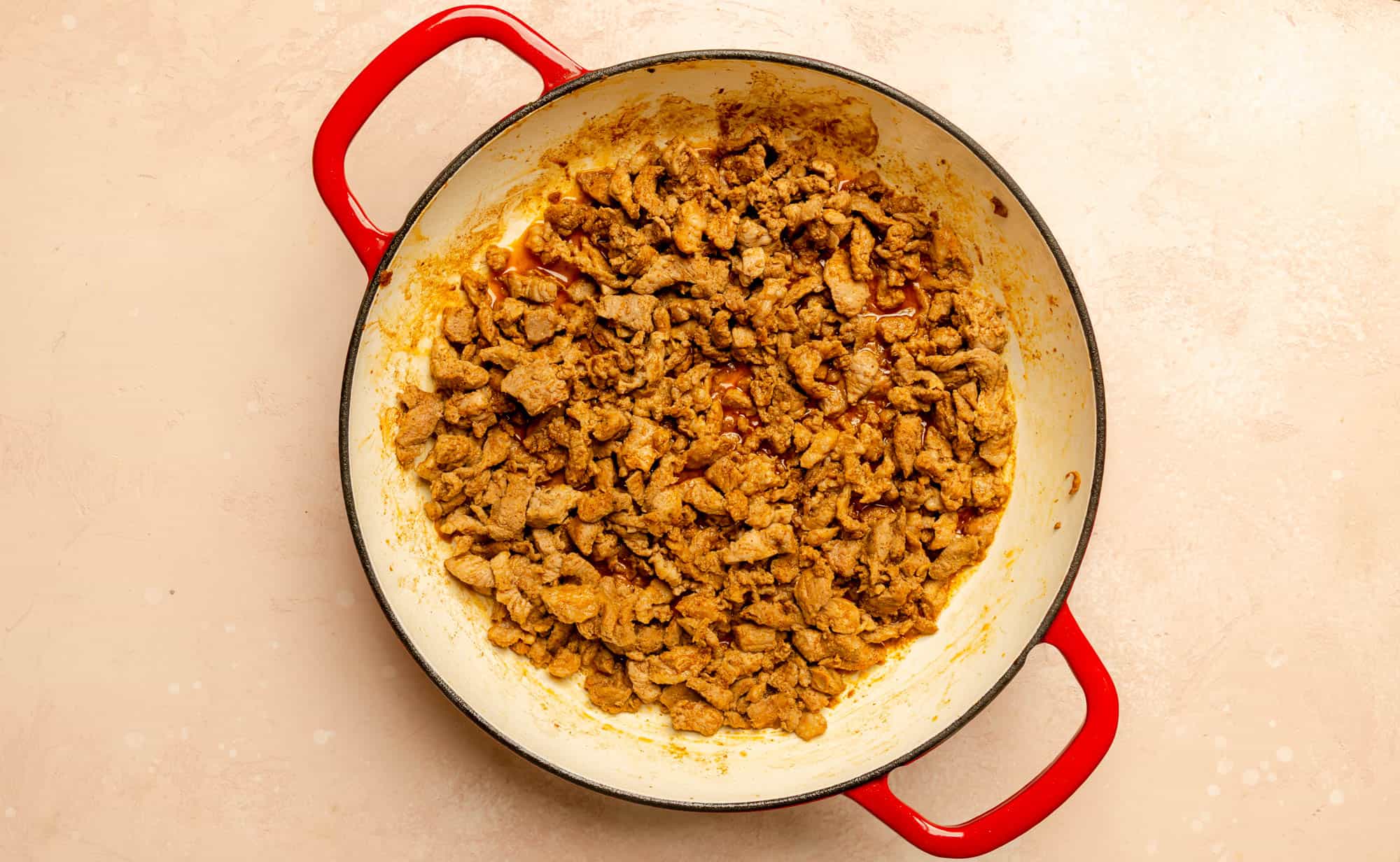 Fully cooked Trader Joe's Al Pastor Diced Pork Shoulder in a pan.