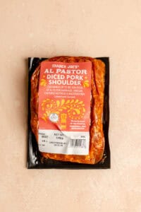 An unopened bag of Trader Joe's Al Pastor Diced Pork Shoulder.
