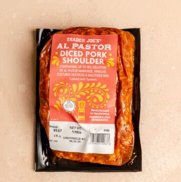 An unopened bag of Trader Joe's Al Pastor Diced Pork Shoulder.