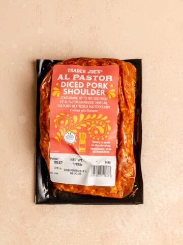 An unopened bag of Trader Joe's Al Pastor Diced Pork Shoulder.