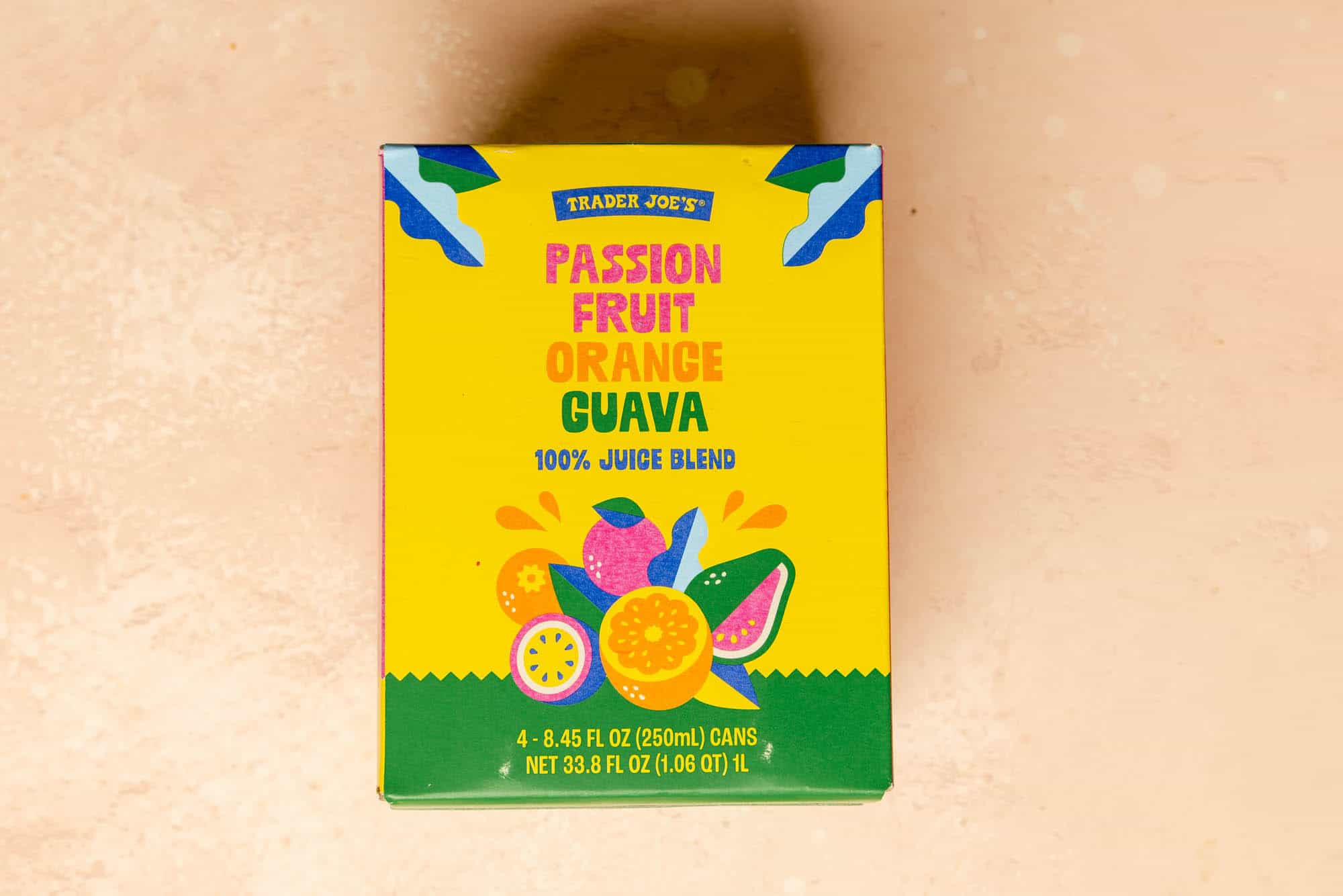 An unopened box of Trader Joe's Passion Fruit Orange Guava Juice.