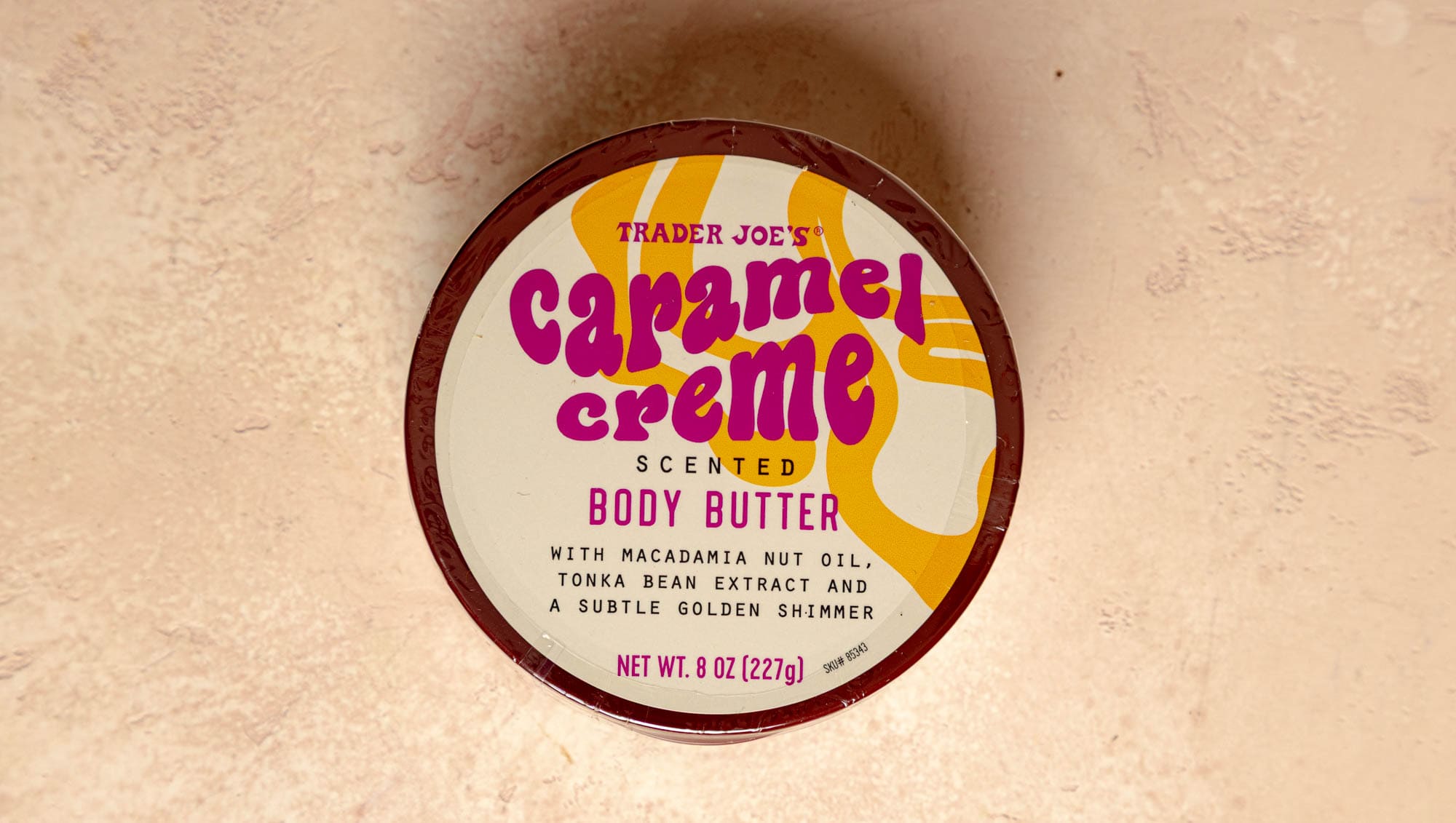An unopened package of Trader Joe's Caramel Creme Scented Body Butter.