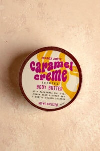 An unopened package of Trader Joe's Caramel Creme Scented Body Butter.