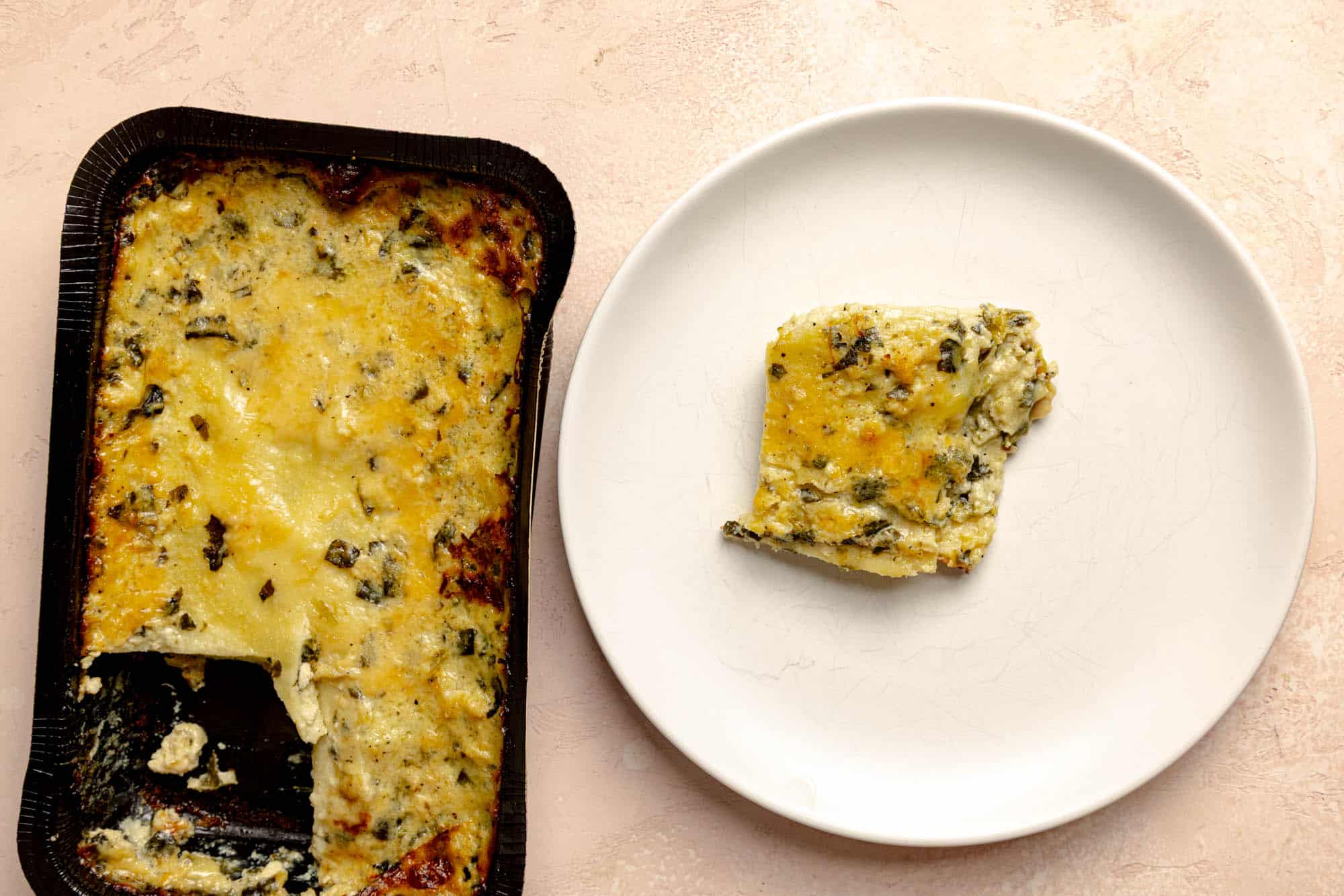 A plate with Trader Joe's Family Style Chicken Florentine Lasagna showing the layers and texture.