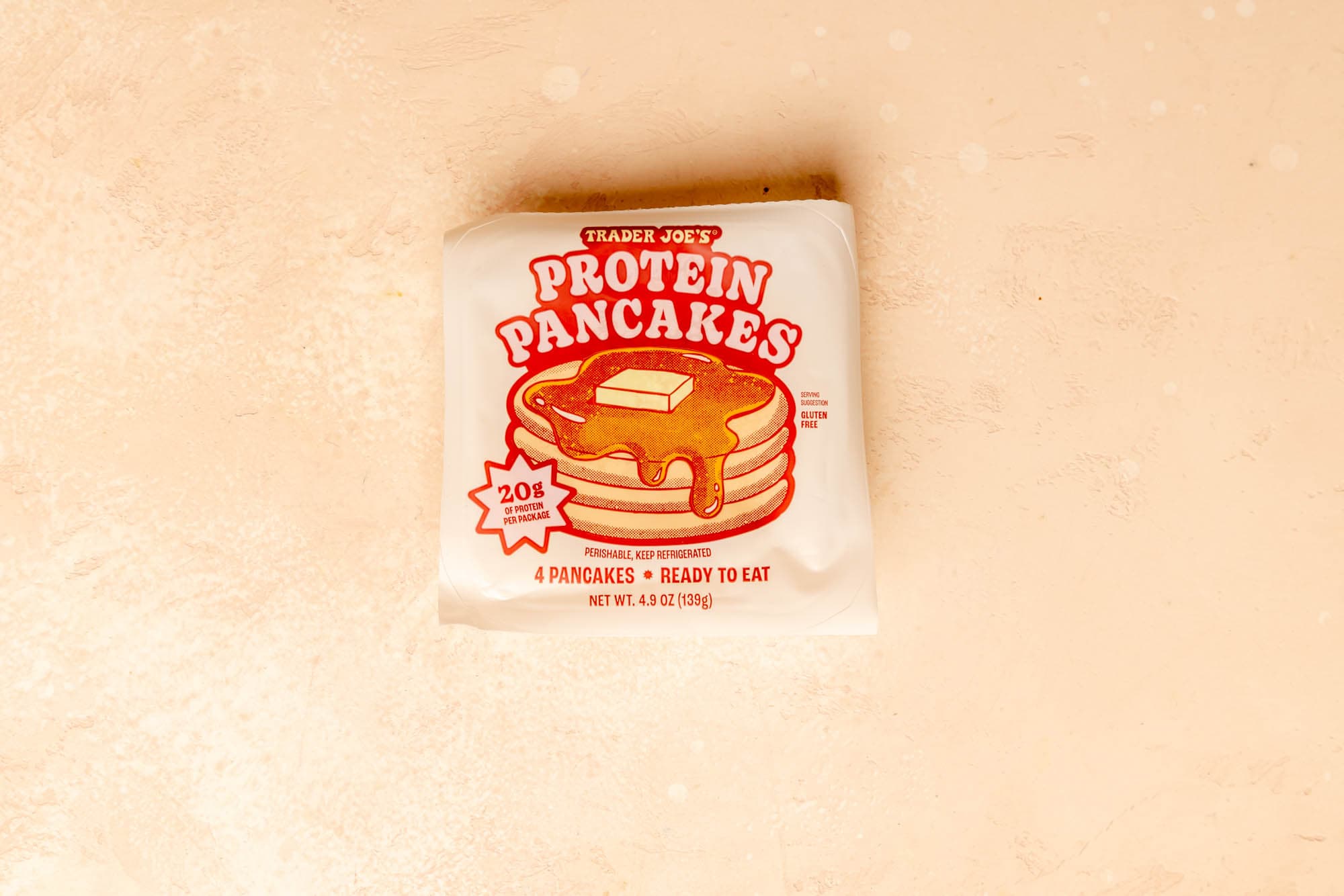 Trader Joe's Protein Pancakes on a pink surface.